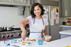 Ayesha Curry laughing in the kitchen